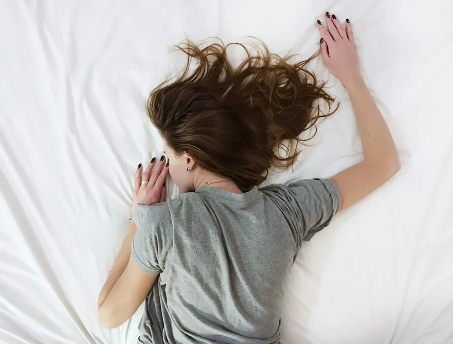 Woman lying on her stomach with her head turned to the side